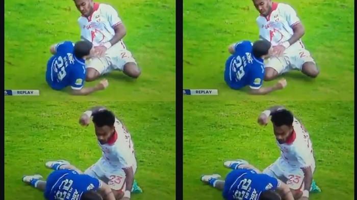 KOMPETISI: Aksi ingin meninju full bek kiri Malut United Yance Sayuri ke pemain Persib Bandung Marc Klok