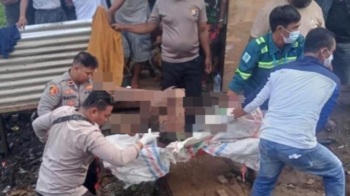 HUKUM: Tampak sejumlah personel Polsek Pulau Obi, Halmahera Selatan mengevakuasi jenazah pria 21 tahun bernama Kristian Roberto Suu, Jumat (17/4/2026). Ia ditemukan tewas di tempat pembuangan sampah (TPS) Desa Kawasi, Kecamatan Pulau Obi