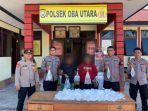 Pasutri-dan-barang-bukti-Miras-jenis-cap-tikus-saat-diamankan-anggota-Polsek-Oba-Utara.jpg