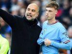 Pelatih-Manchester-City-Pep-Guardiola-dan-sang-pemain-Cole-Palmer-yang-kini-di-Chelsea.jpg