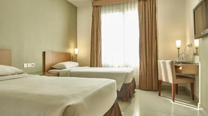 Kamar penginapan di Triniti Hotel Gajah Mada Jakarta.