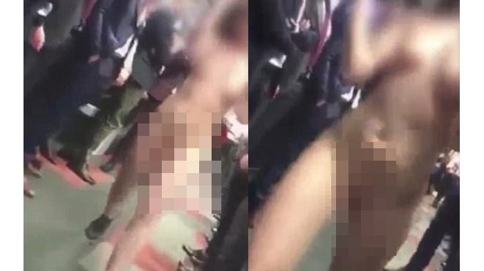 Berjalan Di Antara Para Pria, Wanita Tanpa Busana Ini Hebohkan Perkantoran di Polandia