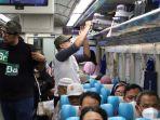 Ilustrasi-Para-Penumpang-Kereta-Api-ketika-Mudik-Lebaran-2024.jpg
