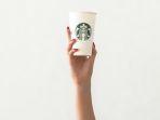 Ilustrasi-barista-memegang-gelas-kopi-Starbucks.jpg