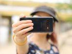 Ilustrasi-selfie-Viral-wanita-nekat-memanjat-kandang-jaguar-demi-dapat-foto-selfie.jpg
