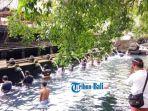 destinasi-wisata-bali-situasi-hari-banyupinaruh-di-pura-tirta-empul-bali.jpg