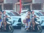 ibu-ibu-melintas-di-jalan-raya-berboncengan-enam.jpg