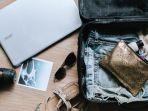 ilustrasi-koper-milik-traveler-wanita.jpg