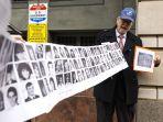 pengeboman-pan-am-penerbangan-103-lockerbie-mengangkat-spanduk-gambar-korban-tambahan.jpg