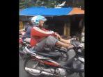 pengendara-motor-dengan-kaki.jpg