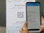 pengunjung-melakukan-scan-barcode-pedulilindungi-saat-memasuki-solo-paragon-mall.jpg