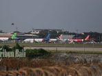 pesawat-dari-berbagai-maskapai-tampak-parkir-di-bandara-i-gusti-ngurah-rai-bali.jpg