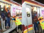 petugas-keamanan-dorong-penumpang-krl.jpg