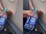 pria-itu-menuangkan-air-di-kaki-penumpang-yang-ada-di-belakangnya.jpg