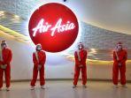 AirAsia Luncurkan Seragam Penerbangan Baru, Pakai Pelindung Wajah dan Masker