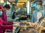 staf-penerbangan-melayani-calon-penumpang-qatar-airways.jpg