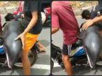 tangkapan-layar-video-dua-warga-membonceng-seekor-lumba-lumba-menggunakan-sepeda-motor-di-bima.jpg