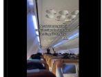 tangkapan-layar-video-viral-suasana-kabin-pesawat-garuda-indonesia.jpg