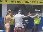 tangkapan-layar-video-viral-wna-dorong-polisi-lalu-lintas-di-jalan-sunset-road-kuta-badung-bali.jpg