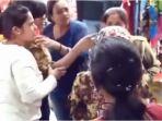 tangkapan-layar-wanita-yang-menampar-seorang-gadis-yang-telah-memanggilnya-bibi.jpg