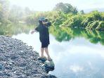 wisatawan-yang-berpose-berlatar-tukad-bengawan.jpg