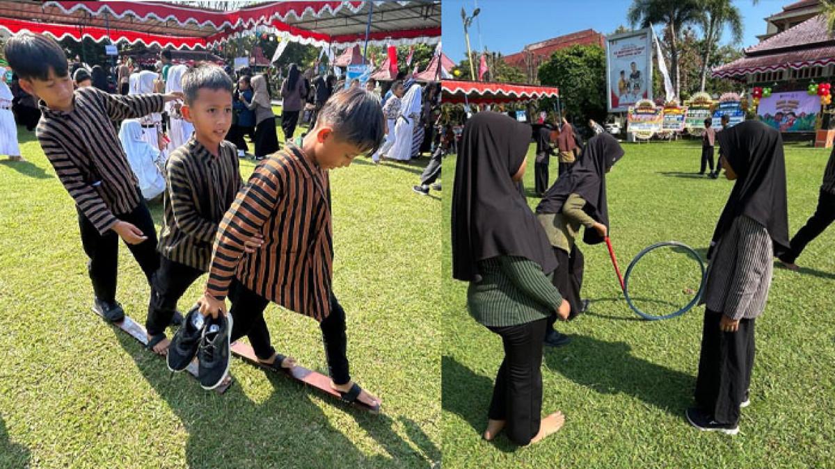 HARI ANAK NASIONAL - Keseruan anak-anak bermain permainan tradisional dalam rangka memperingati Hari Anak Nasional (HAN) ke-41 dengan menggelar permainan tradisional di Pendopo Kabupaten, Kamis (31/7/2025).