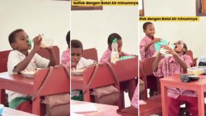 Potret-siswa-SD-Negeri-Niwerawar-Kabupaten-Sarmi-Papua-minum-menggunakan-botol-bekas.jpg