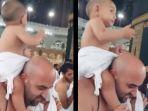 viral-video-balita-ikut-ibadah-haji-digendong-di-pundak-ayahnya.jpg