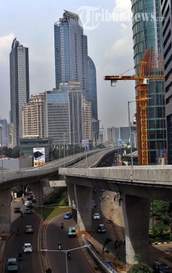 Jokowi Resmikan JLNT Kampung Melayu-Tanah Abang di Bawah Guyuran Hujan