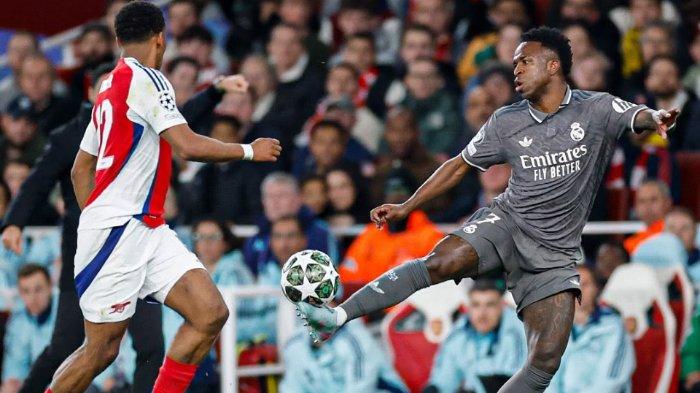 AKSI VINI - Pemain Real Madrid Vinicius Junior ketika menghadapi pemain Arsenal dalam pertandingan leg pertama perempat final Liga Champions 2024/2025 di Stadion Emirates, Rabu (9/4/2025). (Instagram Real Madrid - 9/4/2025)