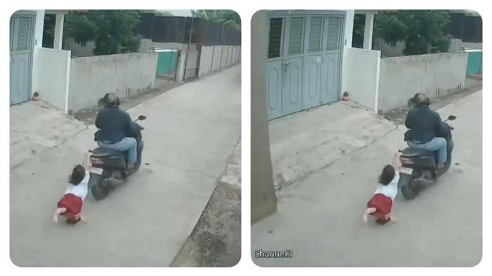 BOCAH SD VS JAMBRET - Anak kecil berpegangan behel sepeda motor milik pria tak dikenal, saat tas dan handphone miliknya dibawa pelaku di  kawasan lorong 36, Gang Perabot, Kelurahan Rengas Pulau, Kecamatan Medan Marelan, Minggu (11/1/2026)