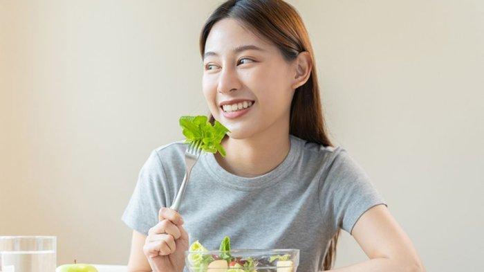Ilustrasi makan makanan sehat sebagai bagian dari diet.