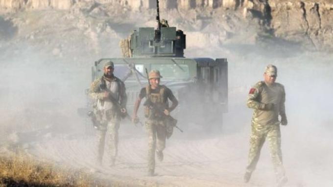 Personel pasukan koalisi pimpinan Amerika Serikat di Irak. Pasukan koalisi ini akan ditarik secara bertahap dari wilayah Irak dan Suriah pada 2025 dan 2026 mendatang.