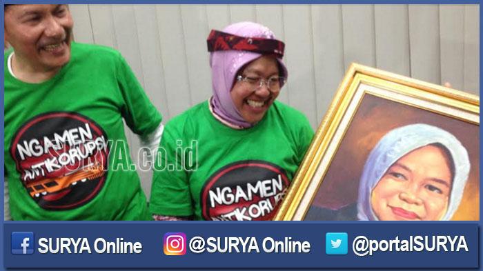pimpinan-kpk-saut-situmorang-dan-wali-kota-surabaya-tri-rismaharini_20160924_135137.jpg