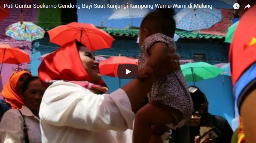 puti-guntur-soekarno-gendong-bayi-saat-kunjungi-kampung-warna-warni-di-malang_20180222_140356.jpg