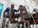 20140227_015145_penyandang-disabilitas-memilih-di-tps-pemilu.jpg