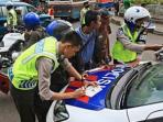 20140326_163026_polisi-lakukan-tilang.jpg