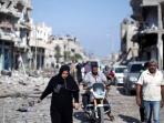 20140802_184039_warga-gaza-berjalan-di-reruntuhan-bangunan.jpg