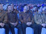 Budi-Arie-Setiadi-tertawa-sembari-menepuk-pundak-Ketua-MPR-RI-Ahmad-Muzani.jpg