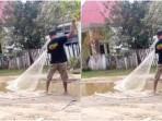 Sindiran Kreatif Warga Muna, Pukat Ditebar di Jalan Rusak yang Tergenang Air