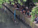 Memancing-Ikan-saat-Banjir_20250129_193713.jpg