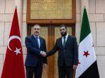 Menteri-luar-negeri-Turki-Hakan-Fidan-bertemu-dengan-pemimpin-HTS-Abu-Mohammed-al-Jolani.jpg