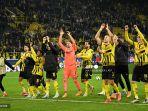 Para-pemain-Dortmund-merayakan-kemenangan-setelah-pertandingan-sepak-bola-Liga-Champions.jpg