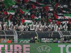 Para-penggemar-Celtic-membentuk-tanda-Bebaskan-Palestina.jpg