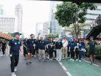 Meriah, Peserta Jalan Sehat Bagi-bagi Bingkisan di Rute Sepanjang 2,5 Km di Momen CFD Jakarta