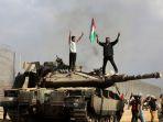 Tank-Merkava-Pasukan-Israel-IDF-yang-hancur-di-pagar-perbatasan-Jalur-Gaza.jpg