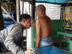 aiptu-taufik-selaku-kapospol-dan-juga-babin-kamtibmas-kecamatan-bataguh-tampak-m_20180117_132627.jpg