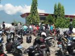 aksi-penjarahan-toko-bahkan-spbu-di-kota-palu-sulteng-oleh-warga-saat-i_20180930_150149.jpg