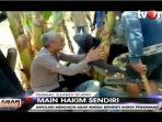 aksi-polisi-memohon-ke-massa-agar-tidak-main-hakim-sendiri.jpg