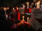 aksi-solidaritas-tragedi-kanjuruhan-malang_20221002_211117.jpg